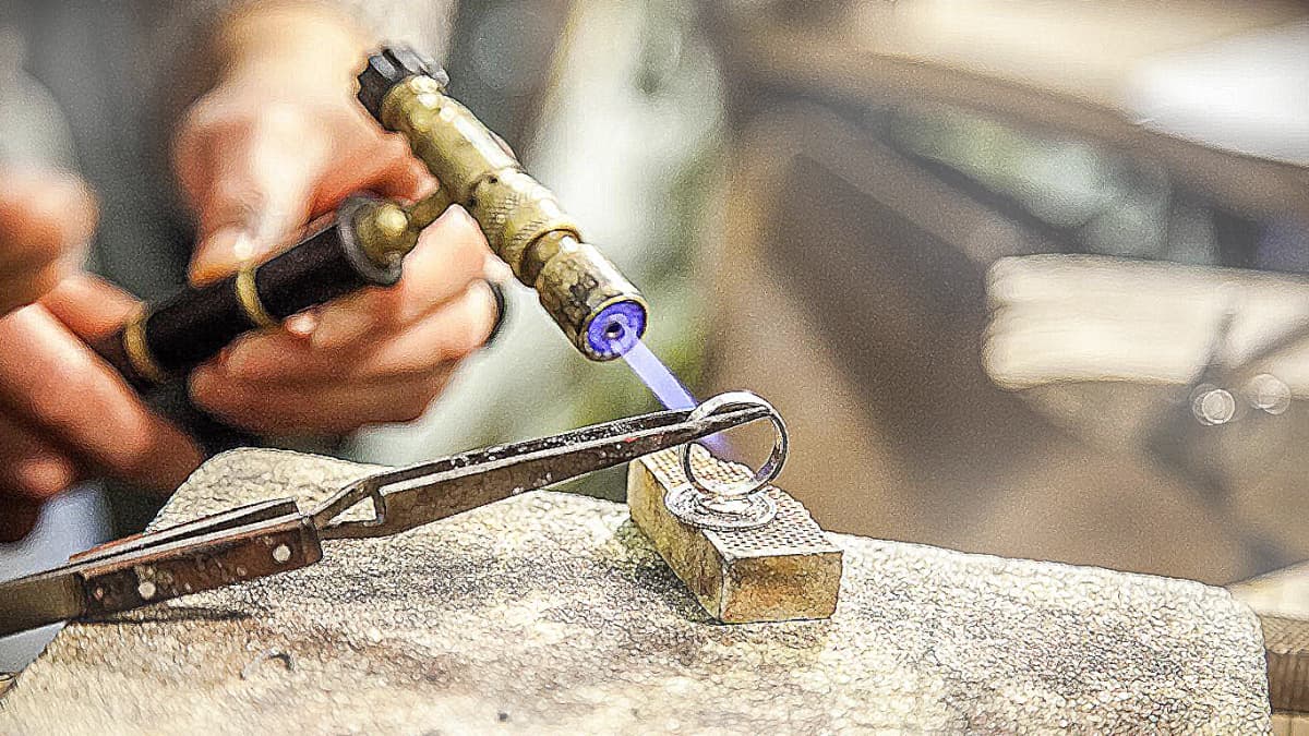 Elegant woman wearing gold jewelry